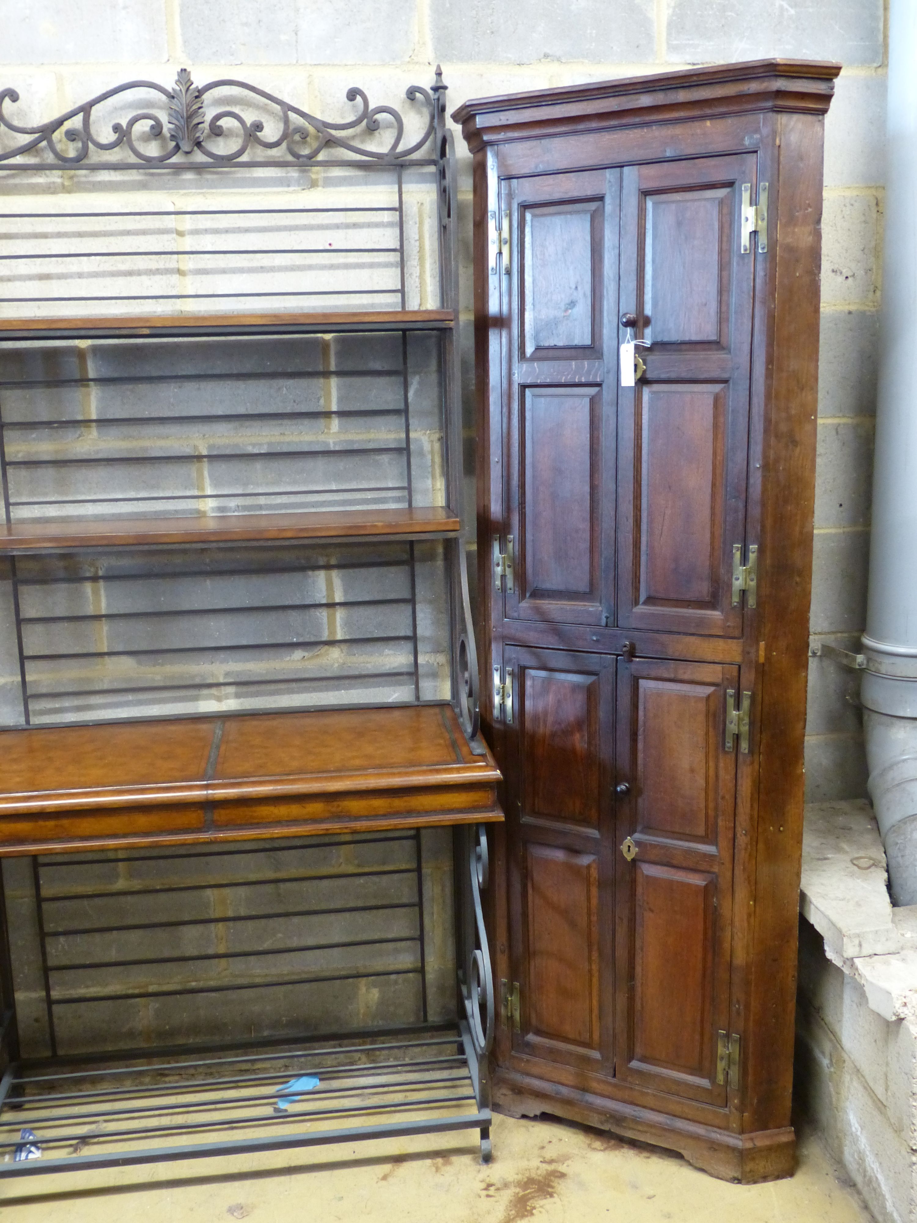 A George III oak standing corner cabinet, width 70cm depth 36cm height 195cm